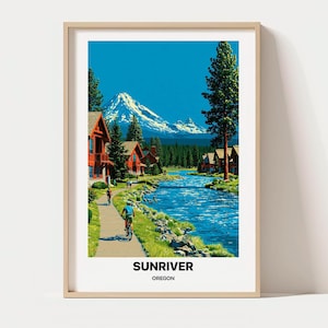 May include: A framed travel poster featuring a vibrant landscape of Sunriver, Oregon. The scene depicts a blue river flowing past red cabins and a paved path with cyclists, set against a backdrop of a snow-capped mountain and tall pine trees.