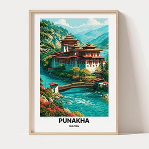 May include: A framed art print featuring a vibrant illustration of the Punakha Dzong in Bhutan, situated by a turquoise river with a bridge, surrounded by lush green trees and mountains, with the text PUNAKHA BHUTAN printed at the bottom.
