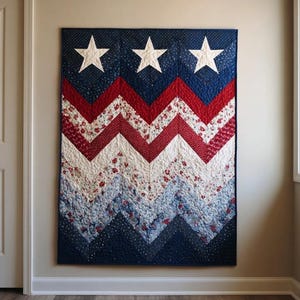 May include: A patriotic quilt with a blue background and three white stars at the top. The quilt features a zig-zag pattern in red, white, and blue floral and dotted fabrics. The quilt is hanging on a wall.
