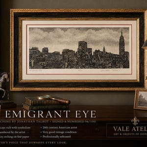 May include: A framed black and white etching titled The Emigrant Eye by Jonathan Talbot, depicting a detailed New York City skyline. The artwork is numbered 96/100, signed by the artist, and housed in a dark wood frame with gold trim.