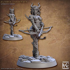 May include: A gray figurine of a female archer with horns, holding a crossbow. The figure is on a round base with sculpted details. The text "AURORA DARKEMBER ALTERNATIVE VERSION!" is at the top.