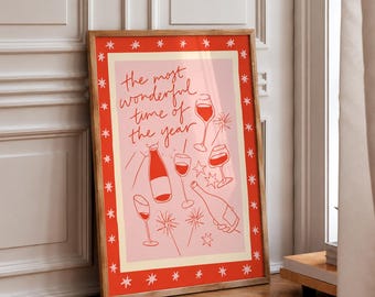 May include: A framed rectangular wall art print featuring a light pink background with a red border decorated with white stars. The text reads, the most wonderful time of the year, surrounded by red line drawings of wine bottles, glasses, and sparklers.