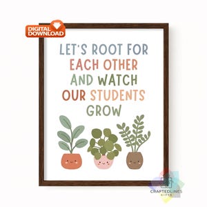 May include: A framed wall art print featuring the text LET'S ROOT FOR EACH OTHER AND WATCH OUR STUDENTS GROW in multi-coloured lettering. Below the text are three illustrated potted plants with simple faces, set against a white background.