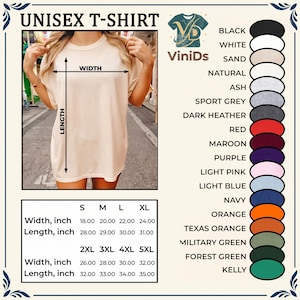 May include: A plain beige short-sleeved t-shirt with a crew neckline. The image includes a size chart with width and length measurements in inches for sizes S through 5XL, and a colour palette list featuring black, white, sand, natural, ash, grey, red, maroon, purple, pink, blue, navy, orange, and green.