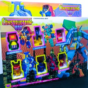 Könnte beinhalten: Eine rechteckige Spielzeugverpackung aus Pappe für Construction Bot Changeable-Bot Figuren. Die Schachtel zeigt bunte Illustrationen von Roboterfiguren und enthält sechs kleine Roboter-Spielzeuge in Form von Baufahrzeugen in Sichtfenstern.