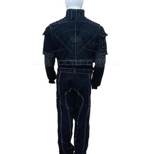 May include: Black jumpsuit with white stitching details. The suit features a high collar, multiple pockets, and a belt. The back of the suit has a graphic design. The jumpsuit is made of a durable material.