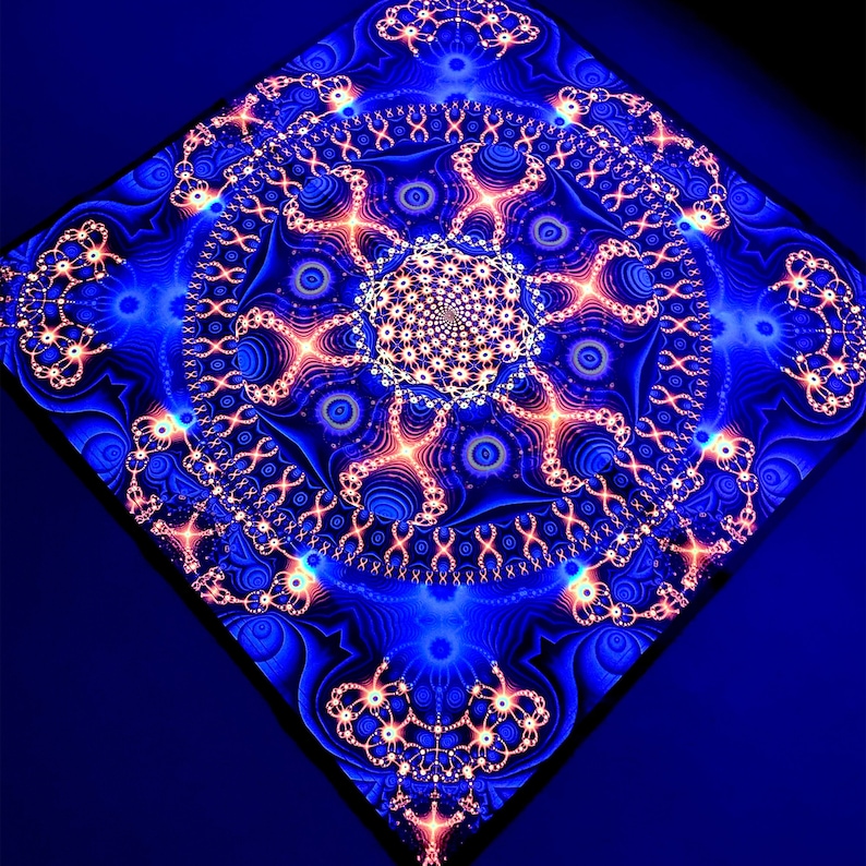 May include: A blue and orange mandala with intricate patterns and details. The mandala is surrounded by a dark blue background.