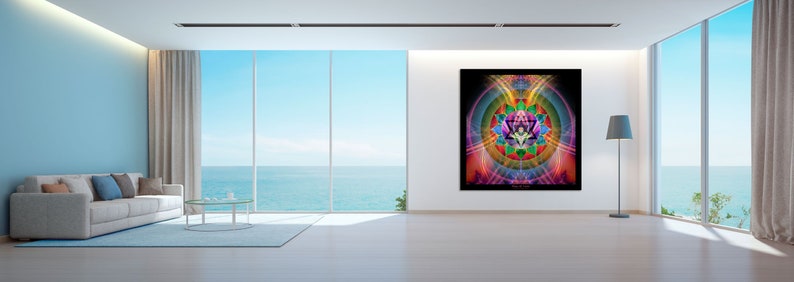 May include: A colorful abstract mandala art print with geometric shapes and vibrant colors, including pink, purple, green, blue, and yellow, hanging on a white wall in a modern living room with a large window overlooking the ocean.