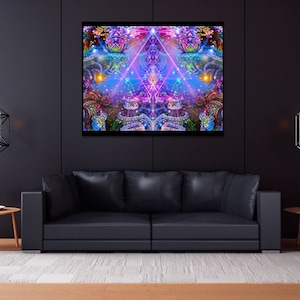 May include: A black leather sofa with a colorful abstract painting hanging above it. The painting features a geometric design with pink, blue, and purple hues. Two black geometric pendant lights hang from the ceiling on either side of the painting.
