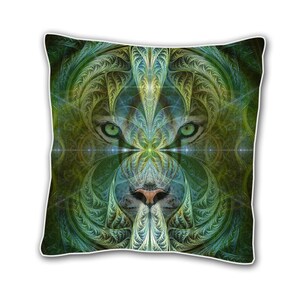 Può includere: Cuscino con motivo verde e giallo con un'immagine stilizzata di un viso di tigre. Gli occhi del tigre sono verdi e il naso è marrone.