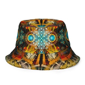 May include: A bucket hat with a colorful geometric pattern featuring a white star of life design in the center. The hat is made of a soft, comfortable fabric and has a wide brim.