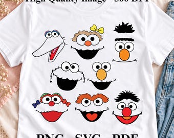 May include: A white t-shirt featuring a graphic print of eight colourful Muppet character faces. The text High Quality Image - 300 DPI is printed at the top, and PNG - SVG - PDF is printed at the bottom of the shirt design.