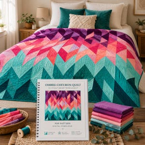 May include: A spiral-bound instructional booklet titled Ombre Chevron Quilt with a digital download PDF pattern. The cover features a colorful geometric triangle design in shades of teal, pink, and purple, matching the large quilt in the background.
