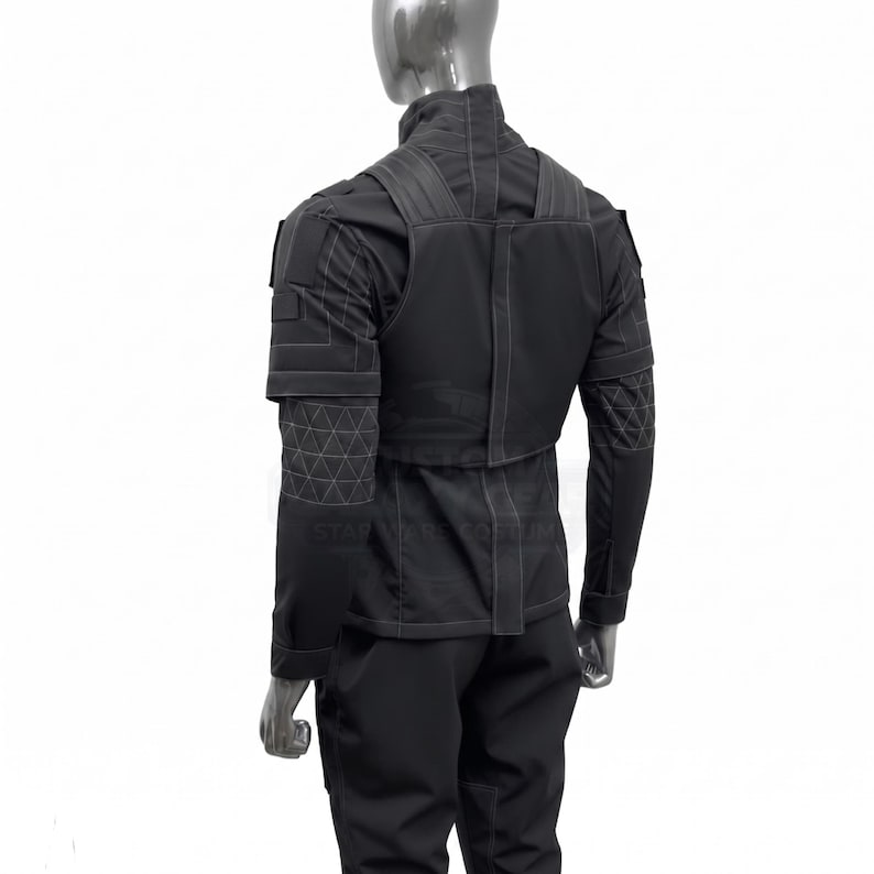 May include: Black tactical uniform, including a jacket with a high collar, shoulder straps, and geometric patterned sleeves. The uniform also features matching pants. The outfit is displayed on a mannequin.