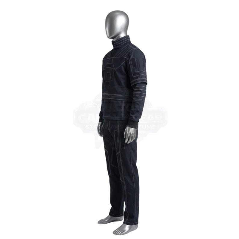 May include: A dark navy blue long-sleeve mock neck shirt and matching trousers set featuring prominent white contrast stitching. The garment displays geometric paneling and linear patterns across the chest, sleeves, and legs, worn on a silver mannequin.
