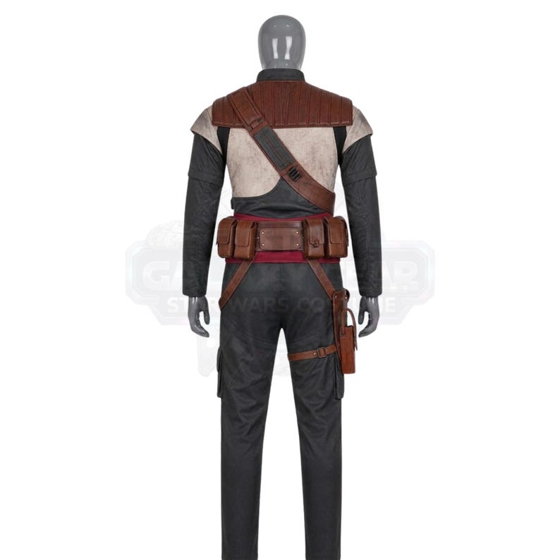 May include: A full-body costume on a mannequin featuring a dark gray long-sleeved top and matching trousers. It includes a brown textured shoulder strap, a wide brown utility belt with multiple pouches, a red waist sash, and a brown leg holster.