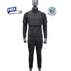 May include: A black tactical uniform displayed on a mannequin. The outfit includes a long-sleeved shirt with a mock turtleneck, a chest plate, and cargo pants. The uniform is designed for a professional or tactical setting.