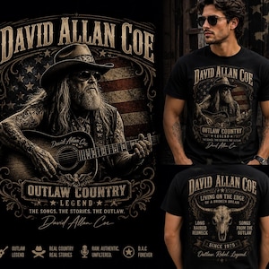 May include: Black t-shirt featuring a graphic of David Allan Coe playing guitar, with an American flag background. The shirt includes the text "OUTLAW COUNTRY LEGEND" and "Living on the Edge of a Broken Dream".