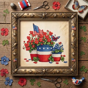 May include: A framed cross-stitch featuring patriotic floral arrangements in red, white, and blue pots, with an American flag. The frame is ornate with stars and eagles. Decorative elements include flowers, butterflies, and miniature flags.