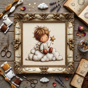 May include: A framed cross-stitch artwork depicts a cherubic figure with wings, seated on a cloud and holding a star wand. The frame is ornate with gold accents and cherubim. Embroidery floss, scissors, and other craft supplies surround the frame.