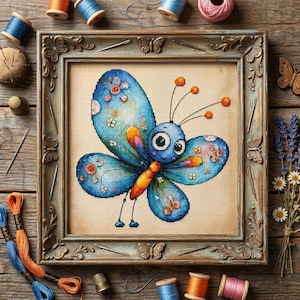 May include: A framed cross-stitch of a cartoon butterfly with blue wings decorated with flowers. The butterfly has a blue body, orange accents, and large eyes. The frame is ornate, and the background is a neutral color. Sewing supplies surround the frame.