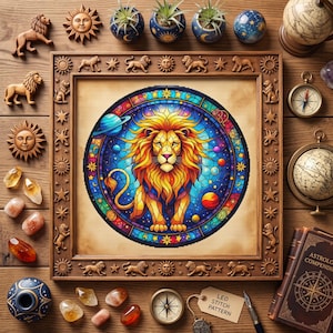 May include: A square wooden frame featuring carved lion and sun motifs surrounds a circular stained glass-style artwork of a lion centered among planets and stars. The scene includes loose crystals, small globes, a compass, and a book.