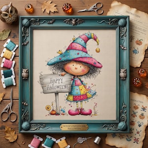 May include: A framed cross-stitch artwork featuring a cartoon character in a colorful patchwork dress and a striped hat, holding a sign that reads HAPPY HALLOWEEN. The teal frame is decorated with owls, bats, and yarn balls, with a brass nameplate.