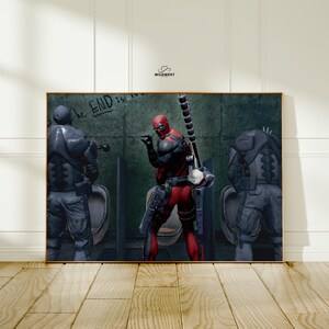 May include: A framed print featuring a comic book scene with Deadpool in a red and black suit, holding a weapon, and two figures in gray armor. The words "The END is near" are written on the wall. The image is set in a bathroom.