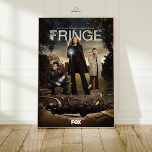 May include: A framed poster for the TV show "Fringe", showing three characters in a dark outdoor scene. The title "FRINGE" is prominent, with the FOX logo at the bottom. The poster includes the text "New Cases. Endless Impossibilities."