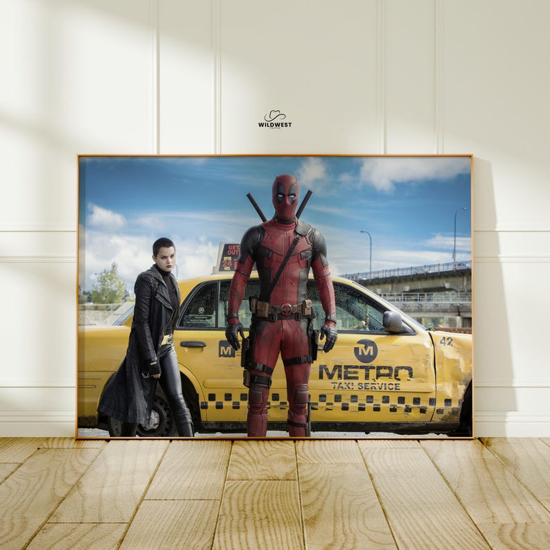 May include: Framed print featuring Deadpool in his red and black costume, standing in front of a yellow taxi cab. A woman in a black coat and pants is standing next to the cab. The taxi has the words "METRO TAXI SERVICE" on the side.