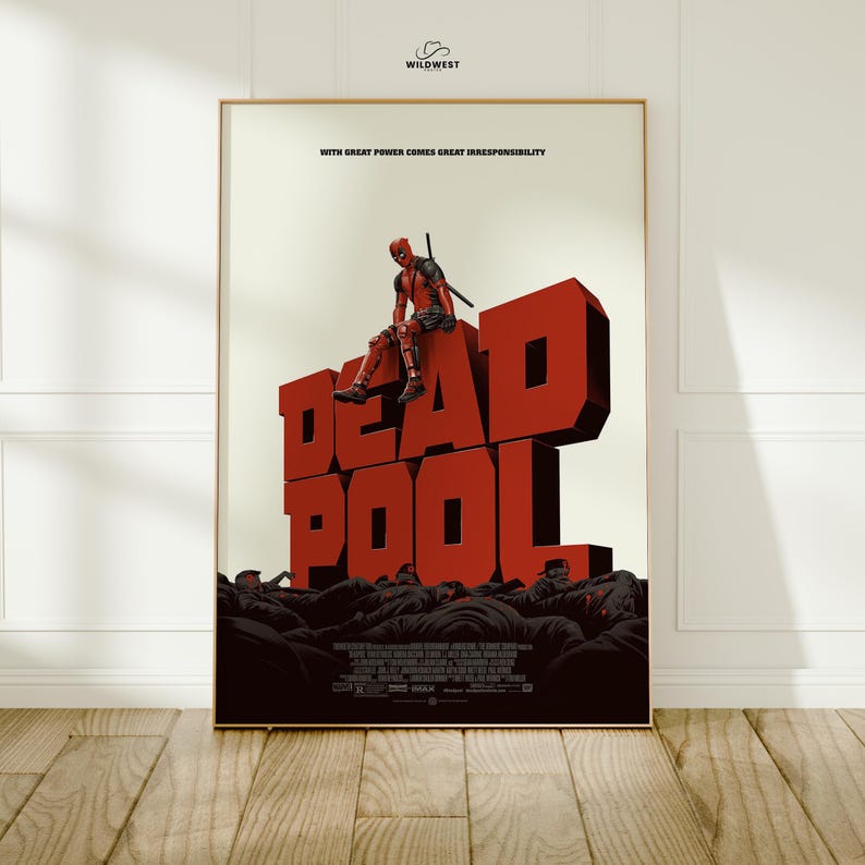 May include: Framed poster featuring the word "DEADPOOL" in large, red, 3D letters. A figure in a Deadpool costume sits atop the letters. The poster includes the text "WITH GREAT POWER COMES GREAT IRRESPONSIBILITY".