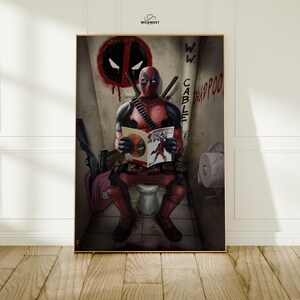 May include: Framed art print featuring Deadpool in a bathroom setting. The character is seated on a toilet, reading a comic book titled "Deadpool". The background includes graffiti and the Deadpool logo.