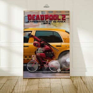 May include: A poster for the movie Deadpool 2. The image features Deadpool riding a pink bicycle next to a yellow taxi. The poster has the text "DEADPOOL 2 EXPERIENCE IT IN IMAX MAY 18".