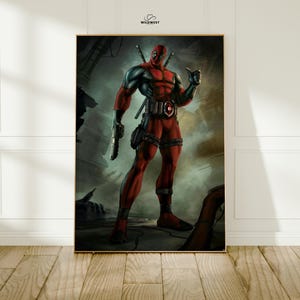 May include: A framed print featuring the Marvel Comics character Deadpool. The artwork depicts Deadpool in his signature red and black suit, holding a gun and giving a thumbs-up. The background is a gritty, industrial setting. The Wildwest logo is in the top right corner.