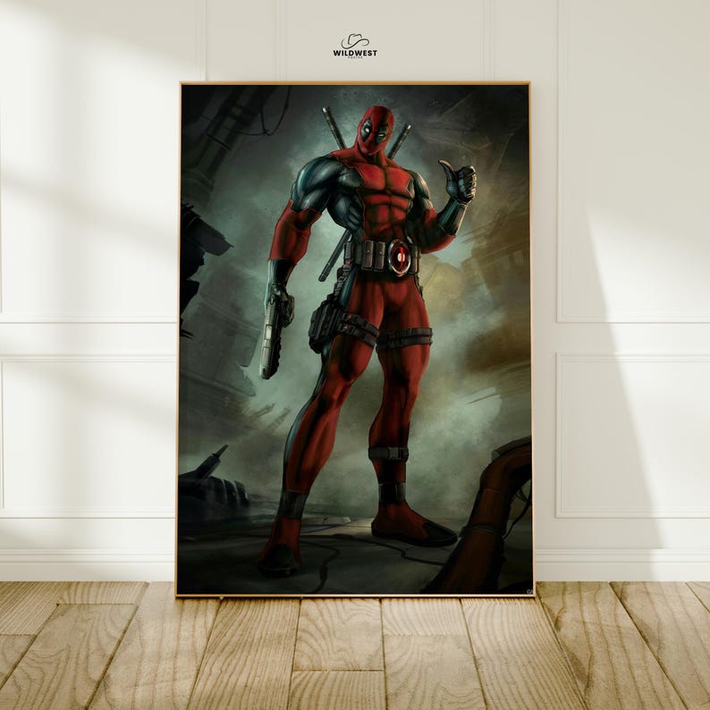 May include: A framed print featuring the Marvel Comics character Deadpool. The artwork depicts Deadpool in his signature red and black suit, holding a gun and giving a thumbs-up. The background is a gritty, industrial setting. The Wildwest logo is in the top right corner.