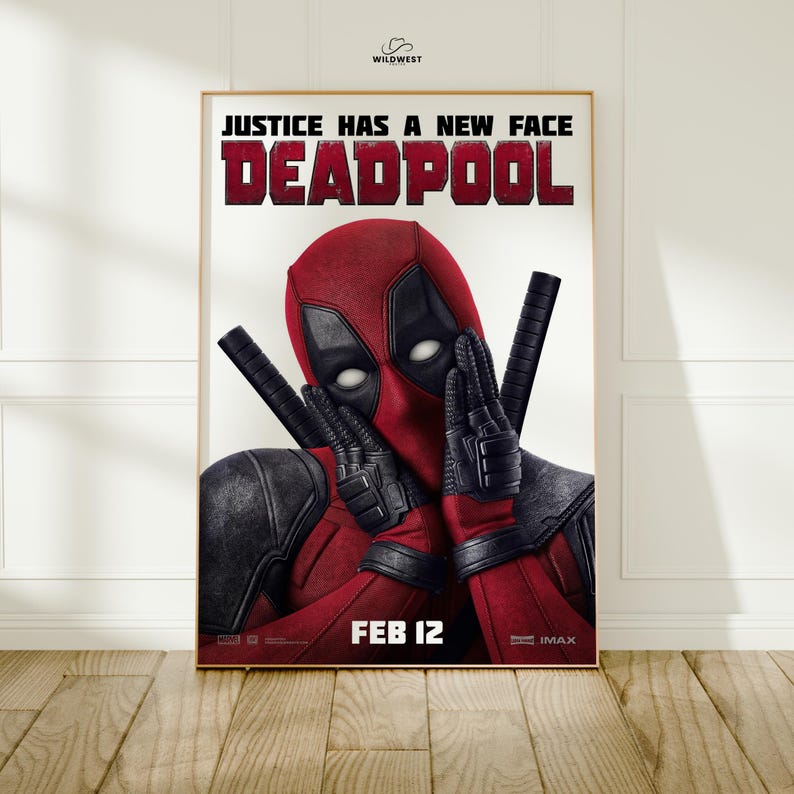 May include: Framed Deadpool movie poster. The poster features Deadpool in his red and black costume, holding two katanas. The text "JUSTICE HAS A NEW FACE DEADPOOL" is at the top, with "FEB 12" at the bottom. The Wildwest logo is in the top right corner.