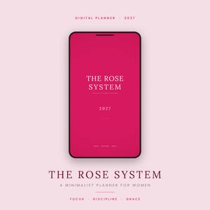 May include: A digital planner displayed on a smartphone screen with a vibrant rose-pink background. The text reads THE ROSE SYSTEM, 2027, and FOCUS DISCIPLINE GRACE. Below the phone, the text repeats THE ROSE SYSTEM A MINIMALIST PLANNER FOR WOMEN.