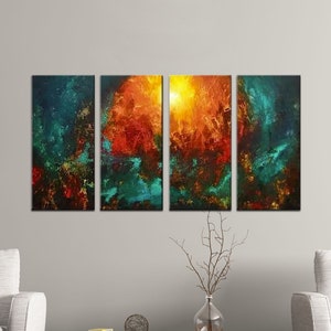 May include: Abstract art painting in four panels, featuring a fiery orange and yellow center surrounded by teal and blue hues. The painting is displayed on a wall above two white armchairs and a wooden coffee table.