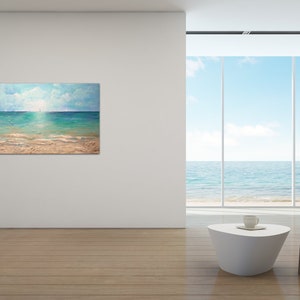 May include: A painting of a seascape with a blue sky, white clouds, and a turquoise ocean. The painting shows a sandy beach with a few sailboats in the distance.
