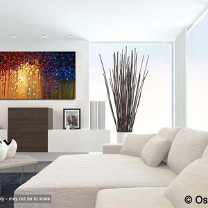 May include: Abstract painting with a colorful, textured, and layered design. The painting features shades of red, orange, yellow, blue, and green. The painting is displayed in a modern living room setting.