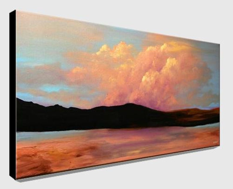 May include: A painting of a landscape with a large pink and orange cloud in the sky above a dark mountain range and a body of water. The sky is a light blue and the water is a light blue with a reflection of the sky.