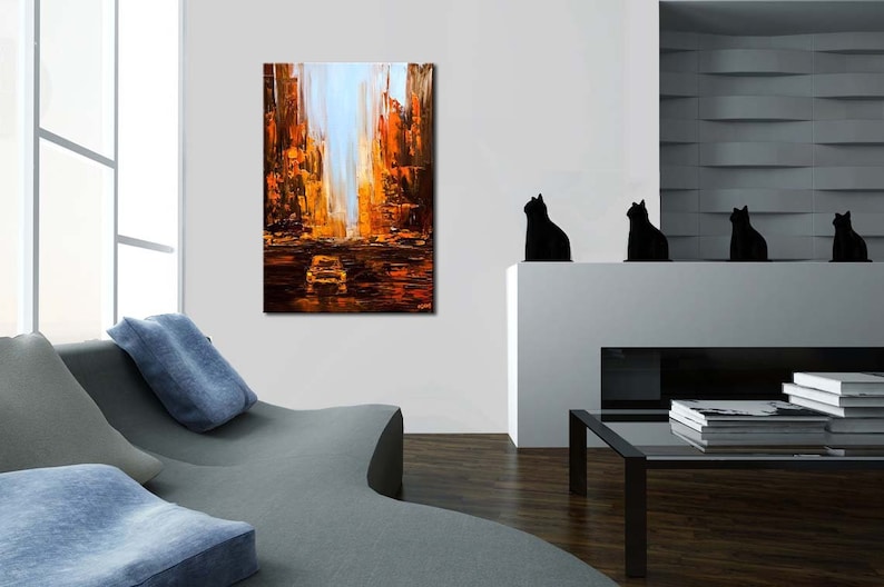May include: Abstract painting of a city street scene with tall buildings in shades of orange, yellow, and brown. A car is visible in the distance.