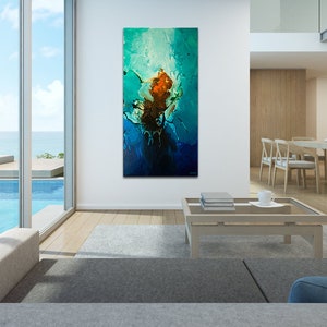 May include: Abstract painting with blue, green, and orange colors. The painting is hanging on a white wall in a modern living room with a pool view.