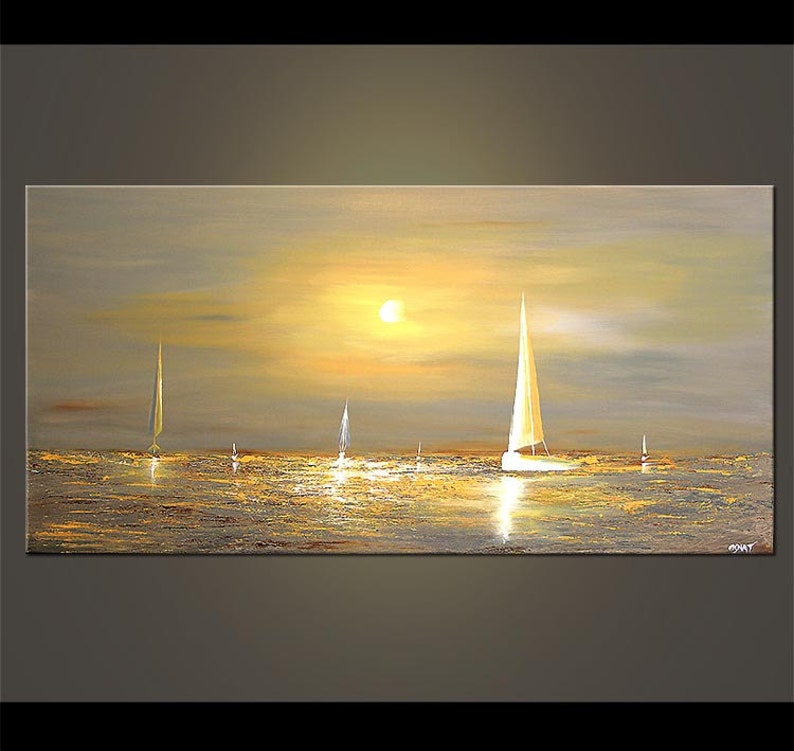 May include: A painting of a sunset over the ocean with sailboats in the water. The sky is a soft yellow and orange, and the water is a shimmering gold. The sailboats are white and have a minimalist design.