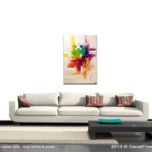 May include: Abstract painting with a white background and colorful geometric shapes in shades of yellow, orange, red, green, purple, and blue. The painting is displayed on a white wall above a white couch with brown pillows.