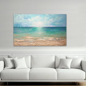 May include: A painting of a seascape with a sandy beach and blue water. The sky is a light blue with white clouds. There are sailboats in the distance.
