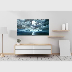 May include: A painting of a night sky with a full moon and clouds. The clouds are a dark gray and the moon is a bright white. The sky is a dark blue.