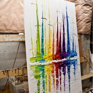 May include: Abstract painting of colorful sailboats reflected in the water. The painting is done in a thick, textured style with bright colors.
