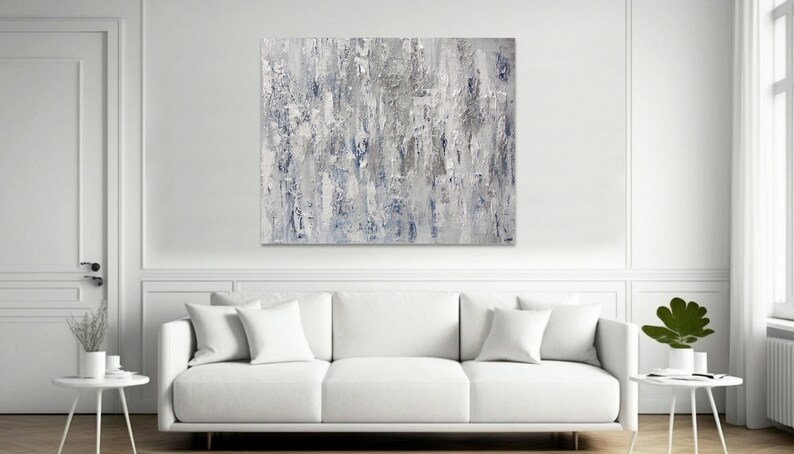 May include: Abstract painting with a textured, layered look. The painting features shades of gray and blue, creating a calming and modern aesthetic.
