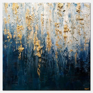 May include: Abstract oil painting with a textured surface. The artwork features a blend of deep blues, white, and gold, creating a layered effect. The brushstrokes are visible, adding depth and dimension to the piece. The painting has a modern aesthetic.
